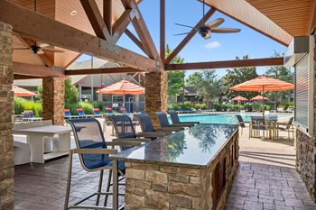 Outdoor cabana with tv, gas grills and wood burning fireplace